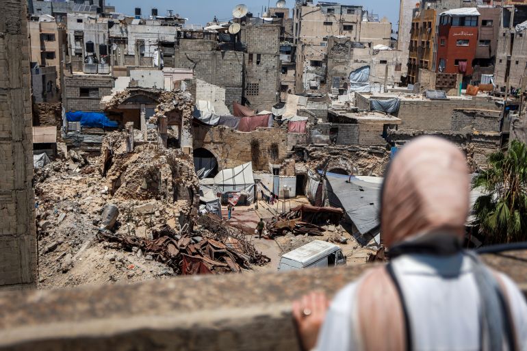 Eman Lulu stands overlooking the destruction of Gaza City