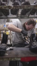 A worker lacing a boot at White’s Boots factory.